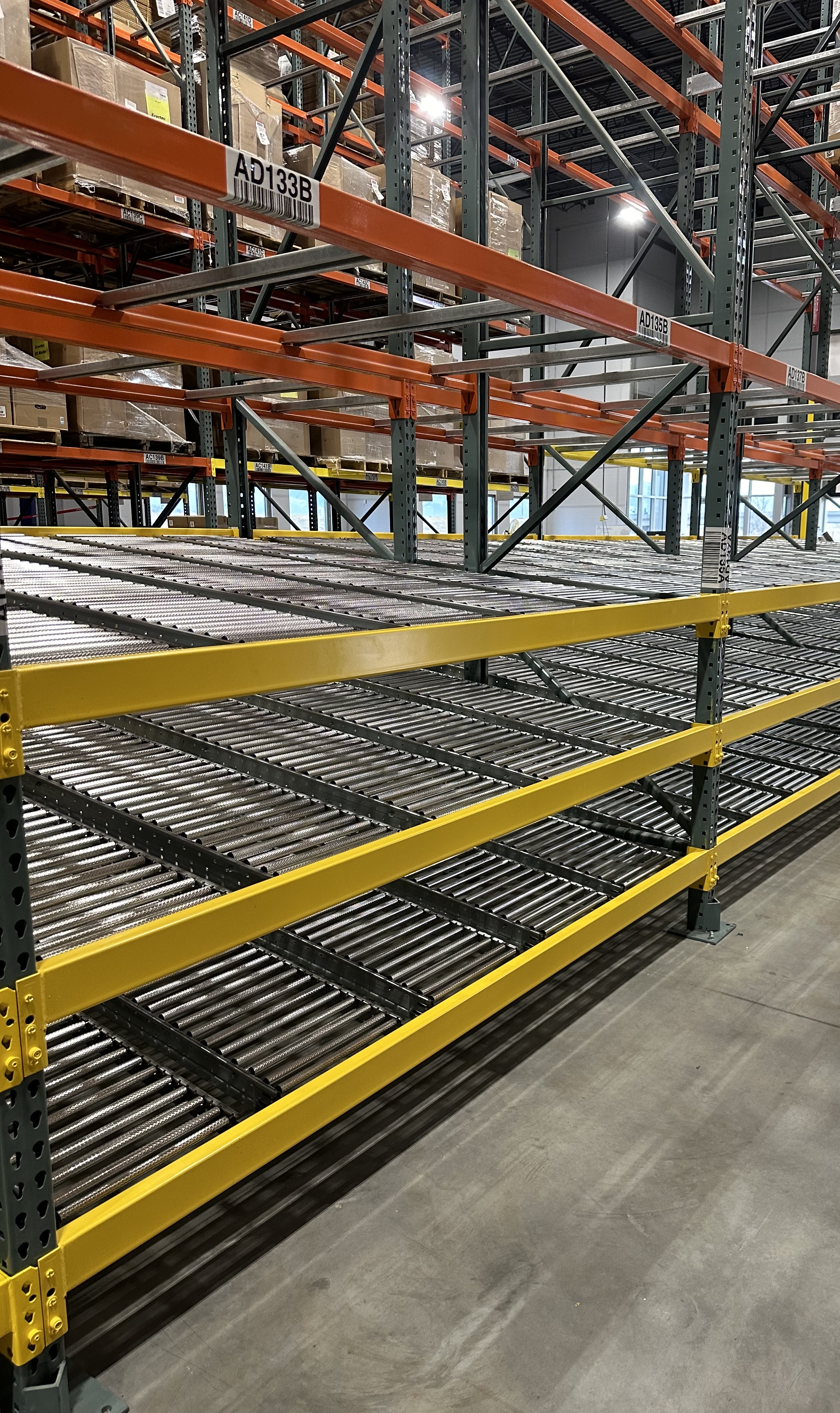 2 short but deep bays of pallet flow racking, 4 levels each.